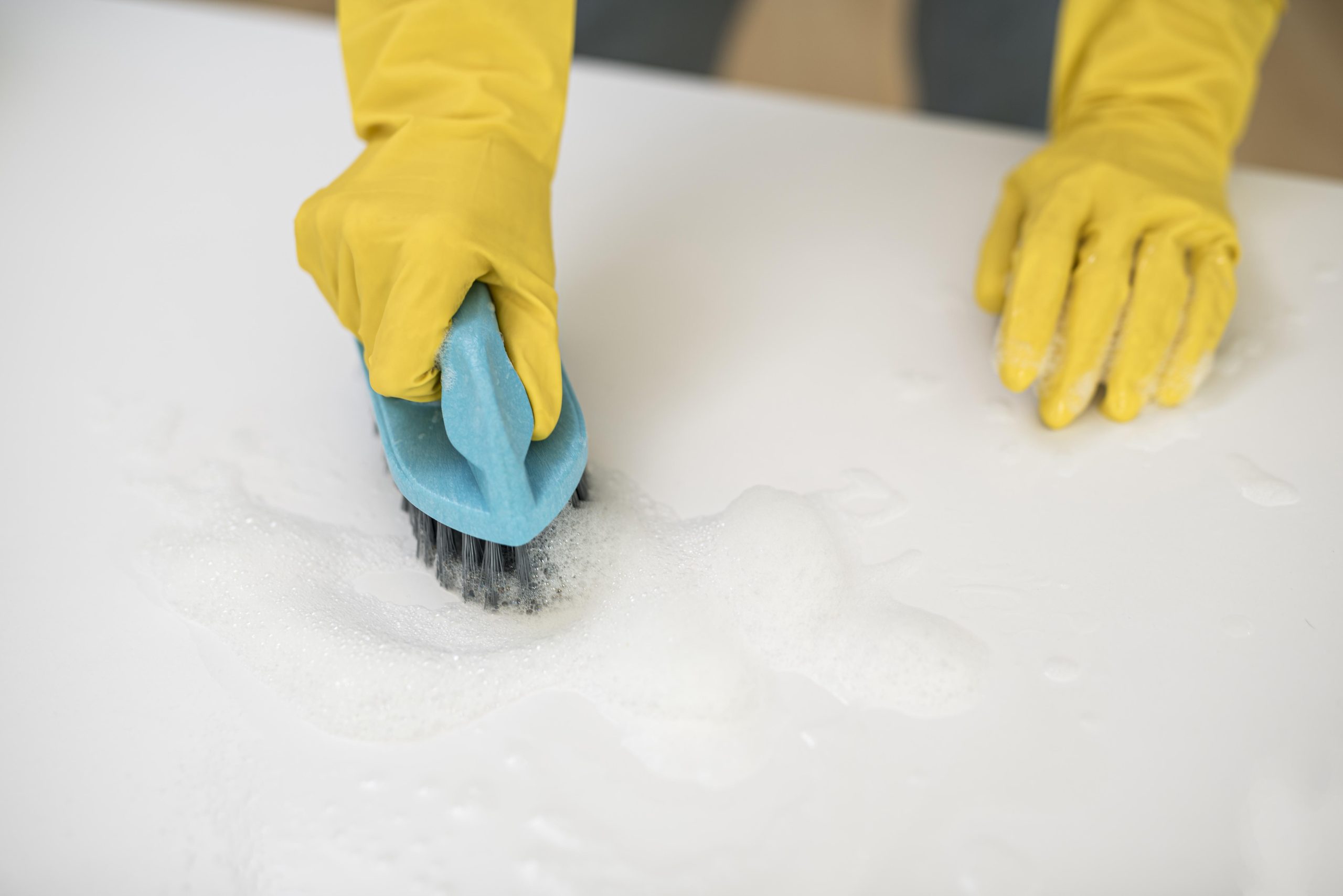 Professional using eco-friendly methods for mattress cleaning in Whitestone NY